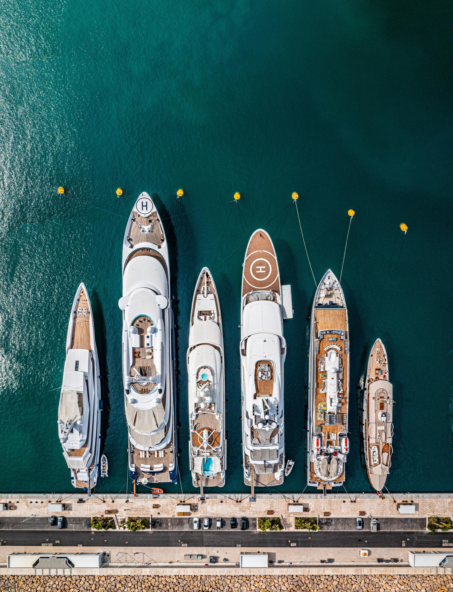Row of luxury super yachts moored in Port Vauban, Antibes, Cote D'Azur, France